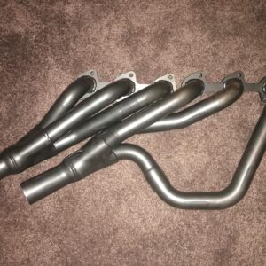 RHD BMW E24 E28 M30 6 cylinder extractors on brown carpet