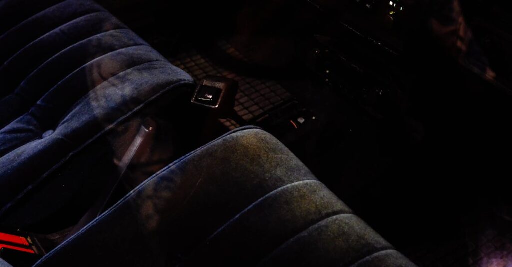 Close-up of a vintage car interior featuring plush seats and classic dashboard controls, perfect for automotive enthusiasts.